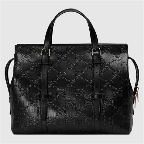 gucci satchel coated embossed gg black|Gucci clutch bag.